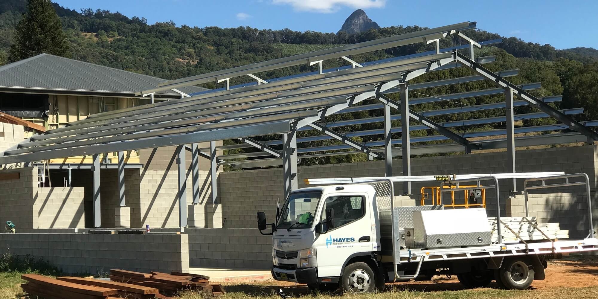 Steel shed frame with delivery truck